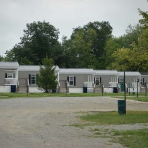 white concrete building near green trees during daytime